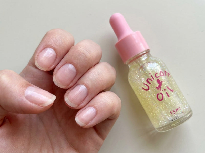 Nails showing dehydration and peeling after acrylic removal